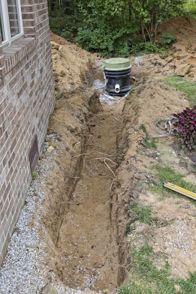 Grinder Pump Installation in Brick